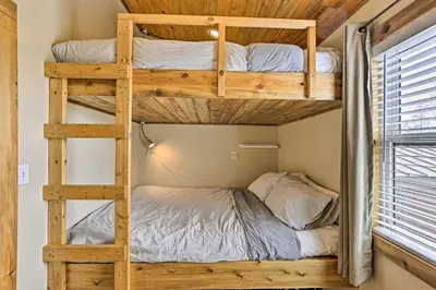 a bedroom with bunk beds in a tiny house at 10 Mi to Ski Condo with Mtn Views in Silverthorne in Silverthorne