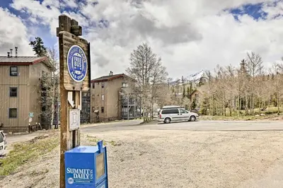 a sign for a snow centre in a parking lot at 10 Mi to Ski Condo with Mtn Views in Silverthorne in Silverthorne