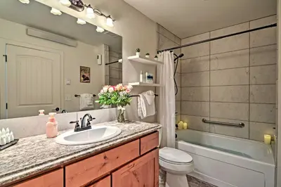 a bathroom with a sink and a toilet and a tub at Estes Park Mountain-View Retreat 3 Miles to RMNP! in Estes Park