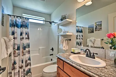 a bathroom with a sink and a toilet and a mirror at Estes Park Mountain-View Retreat 3 Miles to RMNP! in Estes Park