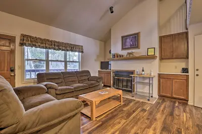 a living room with couches and a fire place at Fireplace and Stream Access Cozy Grand Lake Retreat in Grand Lake