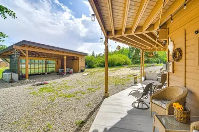 an outdoor patio with awning on a house at Grand Lake House with Mountain Views, Deck! in Grand Lake