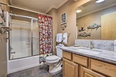 a bathroom with a toilet and a shower and a sink at Grand Lake House with Mountain Views, Deck! in Grand Lake