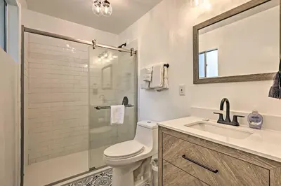 a bathroom with a toilet and a sink and a shower at Direct Beach Access Grand Lake Cabin with Deck! in Grand Lake