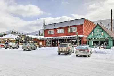 a group of cars parked in a parking lot in front of a building at Direct Beach Access Grand Lake Cabin with Deck! in Grand Lake