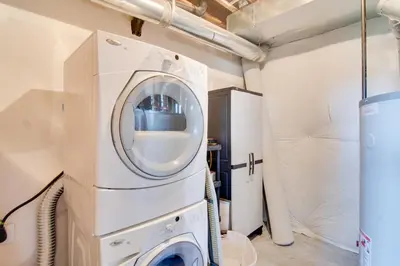 a washer and dryer in a laundry room at Winter Park Chalet with Hot Tub and Free Shuttle! in Fraser