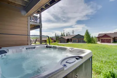 a hot tub in the backyard of a house at Winter Park Chalet with Hot Tub and Free Shuttle! in Fraser