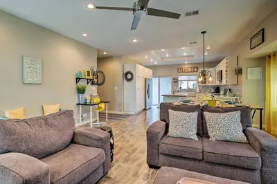 a living room with two couches and a kitchen at 7 Mi to Dtwn Denver Arvada Home with Patio in Arvada