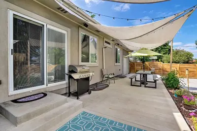 a patio with a grill and a table and chairs at 7 Mi to Dtwn Denver Arvada Home with Patio in Arvada