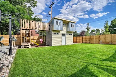 a tiny house in a yard with a backyard at 7 Mi to Dtwn Denver Arvada Home with Patio in Arvada