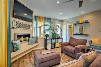 a living room with a fireplace and a tv at 7 Mi to Dtwn Denver Arvada Home with Patio in Arvada