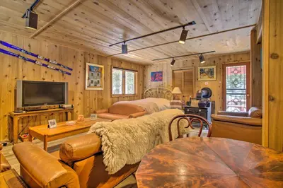 a bedroom with a bed and a tv in a room at Tranquil Dumont Home with Creek and Mtn Views! in Dumont