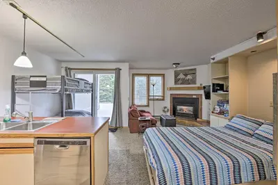 a kitchen and living room with a bed and a sink at Iron Horse Studio with Resort Amenities Walk to WP! in Winter Park