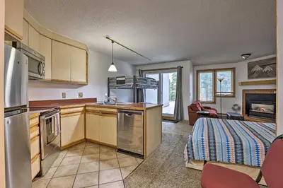 a kitchen with a sink and a stove at Iron Horse Studio with Resort Amenities Walk to WP! in Winter Park