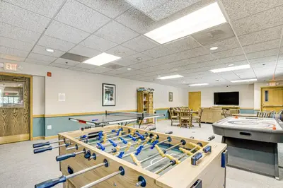 a gym with ping pong tables and ping pong balls at Iron Horse Studio with Resort Amenities Walk to WP! in Winter Park