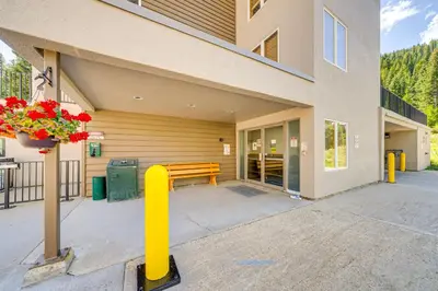 a building with a bench in front of it at Iron Horse Studio with Resort Amenities Walk to WP! in Winter Park