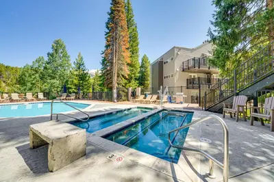 a large swimming pool with a resort style building at Iron Horse Studio with Resort Amenities Walk to WP! in Winter Park
