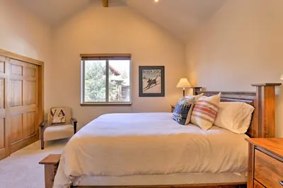 a bedroom with a large bed and a window at Riverfront Silverthorne Condo Near Skiing! in Silverthorne