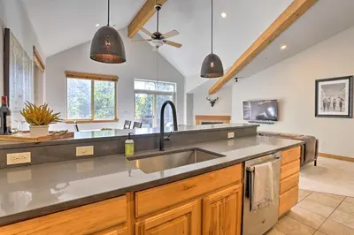 a kitchen with a sink and a counter top at Riverfront Silverthorne Condo Near Skiing! in Silverthorne