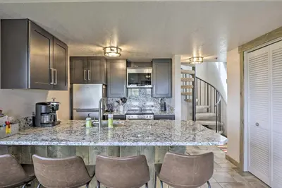 a kitchen with a large marble counter top at Updated Studio Loft in Granby Epic Mountain Views in Granby