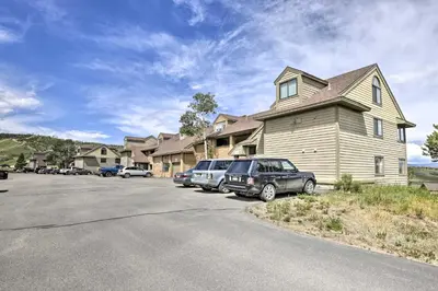 a house with cars parked in a parking lot at Updated Studio Loft in Granby Epic Mountain Views in Granby