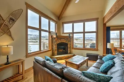 a living room with a couch and a fireplace at 3 Mi to Granby Ranch Family-Friendly Home in Granby