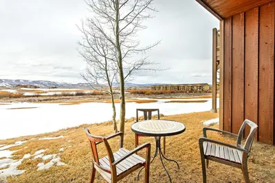 a patio with a table and two chairs and a tree at 3 Mi to Granby Ranch Family-Friendly Home in Granby