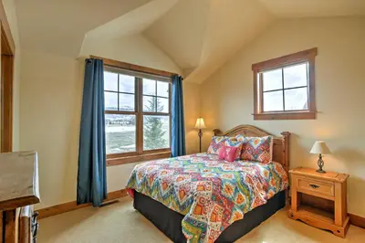 a bedroom with a bed and a window at 3 Mi to Granby Ranch Family-Friendly Home in Granby