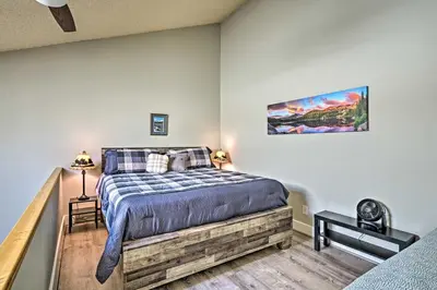 a bedroom with a large bed in a room at 2 Mi to Granby Ranch Condo with Hot Tub Access in Granby