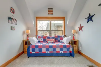 a bedroom with a blue bed and stars on the wall at Riverfront Cabin, 4 Mi to Granby Ranch in Granby