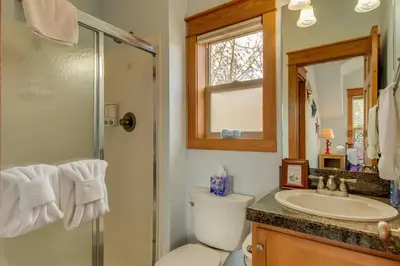 a bathroom with a toilet and a sink and a shower at Riverfront Cabin, 4 Mi to Granby Ranch in Granby