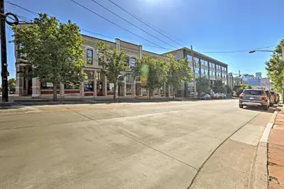 an empty street in front of a building at LoHi Apartment with Patio 1 Mi to Downtown Denver! in Denver
