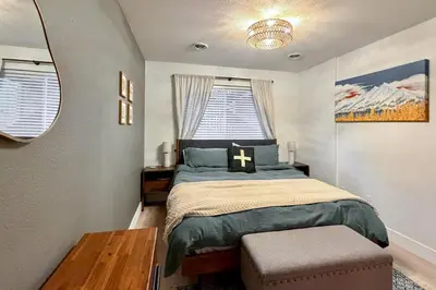 a small bedroom with a bed and a window at Walk to Main St Frisco Condo with Community Pool! in Frisco