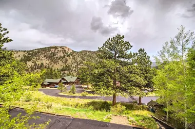 an aerial view of a resort with trees and a mountain at Estes Condo 3 Mi to Rocky Mountain National Park in Estes Park