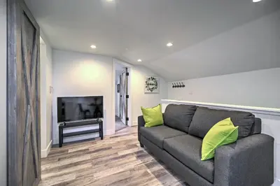 a living room with a couch and a flat screen tv at Dtwn Golden Apt Less Than 9 Mi to Red Rocks Amphitheater! in Golden