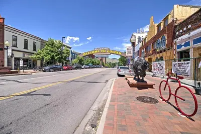 a street in a town with a statue on a sidewalk at Dtwn Golden Apt Less Than 9 Mi to Red Rocks Amphitheater! in Golden