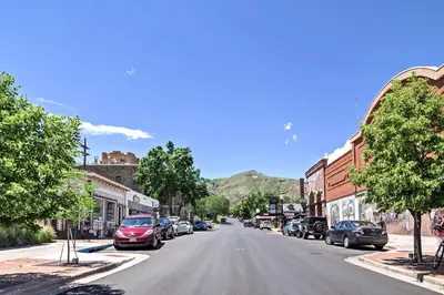 an empty street in a small town with cars parked at Dtwn Golden Apt Less Than 9 Mi to Red Rocks Amphitheater! in Golden