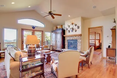 a living room with a couch and a fireplace at Lake and Mountain Views Stunning Estes Park Home! in Estes Park
