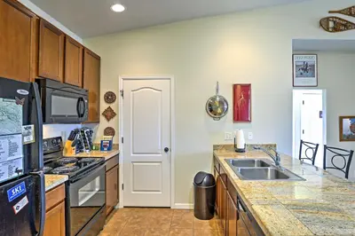 a kitchen with a sink and a stove at 18 Mi to Winter Park Granby Condo with Covered Deck in Granby