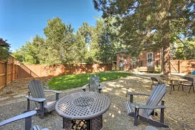 a patio with chairs and a table and a table and chairs at Historic Apartment - Walk to CSU Campus and Old Town in Fort Collins