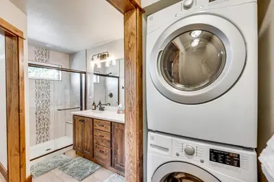 a laundry room with a washer and dryer at Newly Built Estes Park Townhome, 2 Miles to RMNP! in Estes Park