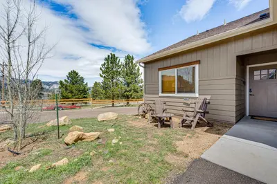 a home with a patio and a house at Newly Built Estes Park Townhome, 2 Miles to RMNP! in Estes Park
