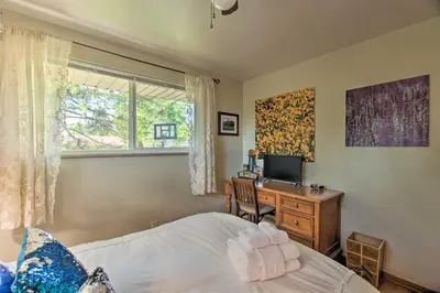 a bedroom with a bed and a desk and a window at Private Lake Family Home with Large Yard in Denver! in Denver