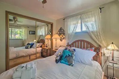 a bedroom with two beds and a large mirror at Private Lake Family Home with Large Yard in Denver! in Denver