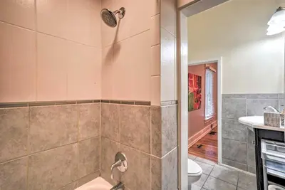 a bathroom with a shower with a toilet and a sink at Historic Redstone with Large Backyard, Walk To CSU! in Fort Collins