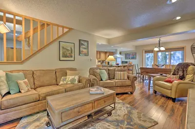 a living room with a couch and a table at Creekside Frisco Condo with Views and Pool Access! in Frisco