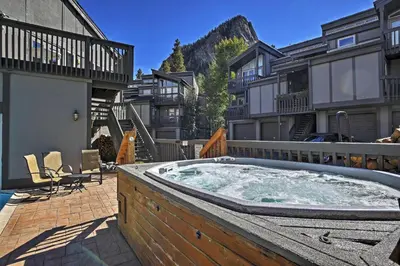 a hot tub in the middle of a courtyard with buildings at Creekside Frisco Condo with Views and Pool Access! in Frisco