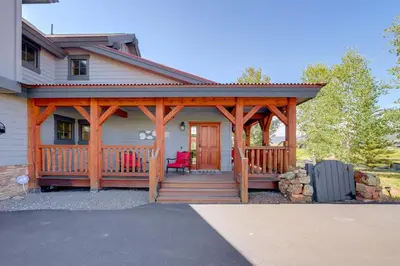 a home with a wooden gazebo at Grand Elk Golf Club On-Site Mtn-View Home with Deck in Granby