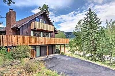 an exterior view of a house with a deck at Peaceful Pines Estes Park Home Longs Peak View in Estes Park