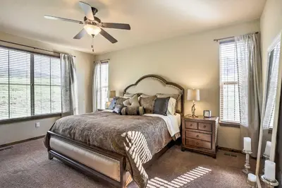 a bedroom with a bed and a ceiling fan at Patio, Fire Pit, and Ski Mountain View Granby Home in Granby